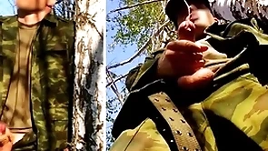 Russian soldier with a big dick on a military mission in the forest shoots sperm from his penis at opponents
